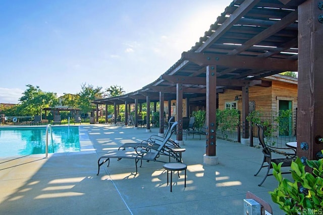 pool with a pergola and a patio