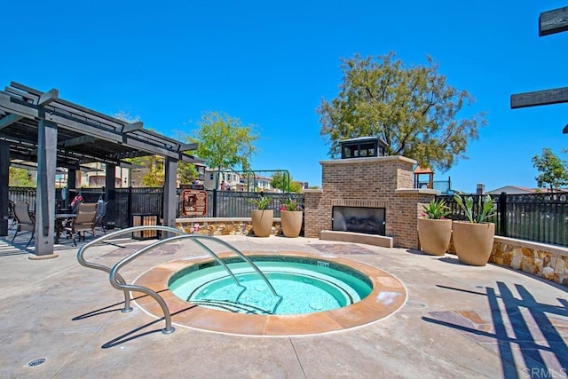 view of swimming pool featuring a hot tub, an outdoor brick fireplace, a patio, fence, and a pergola