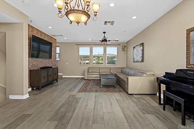 living area featuring visible vents and light wood-style floors