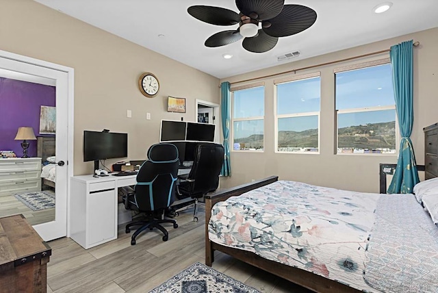 bedroom featuring light wood-type flooring, visible vents, and recessed lighting