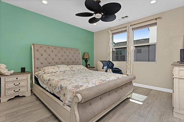 bedroom with recessed lighting, visible vents, light wood-style floors, a ceiling fan, and baseboards