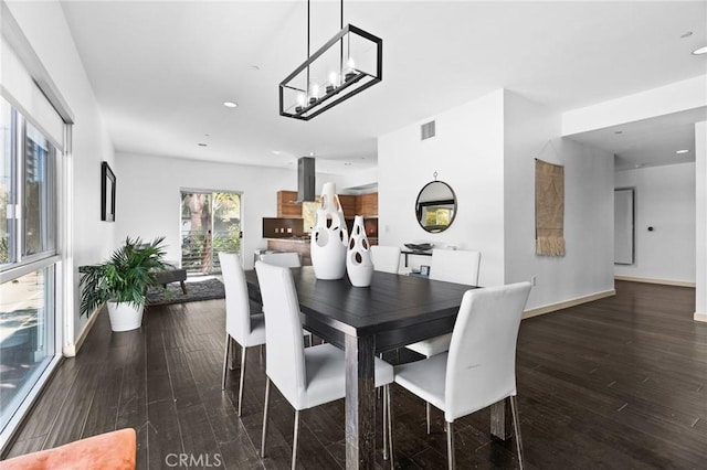 dining area with visible vents, baseboards, wood finished floors, and recessed lighting