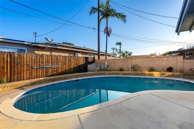 view of pool featuring a patio, a fenced backyard, and a fenced in pool