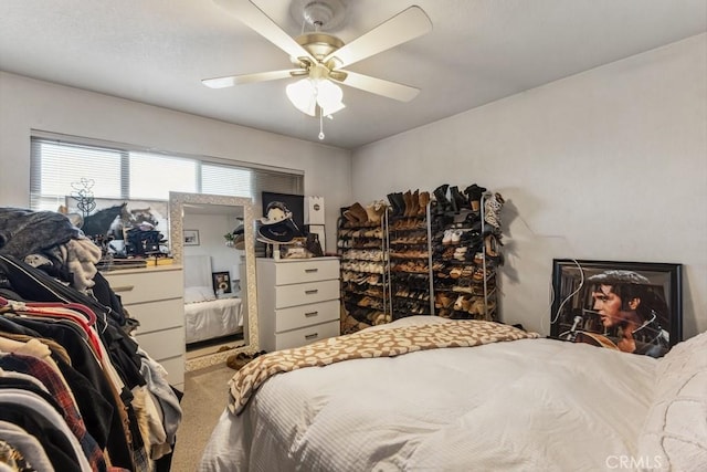 carpeted bedroom with a ceiling fan