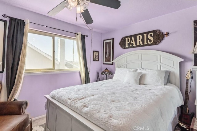 carpeted bedroom with a ceiling fan