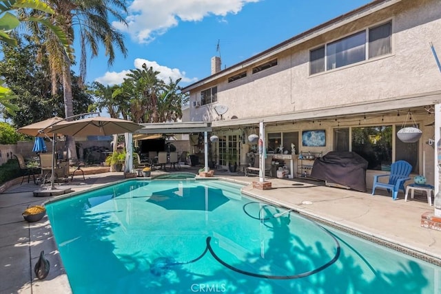 view of pool with a patio and a fenced in pool