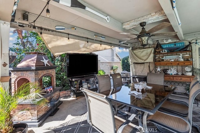 view of patio featuring outdoor dining area and ceiling fan