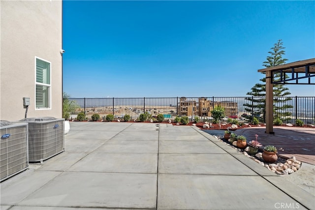 view of patio / terrace with fence and central AC