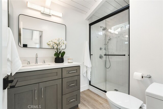 207 E Edgewater Ave Unit A, Newport Beach, CA 92661 - full bathroom with a shower stall, wood finished floors, toilet, and vanity
