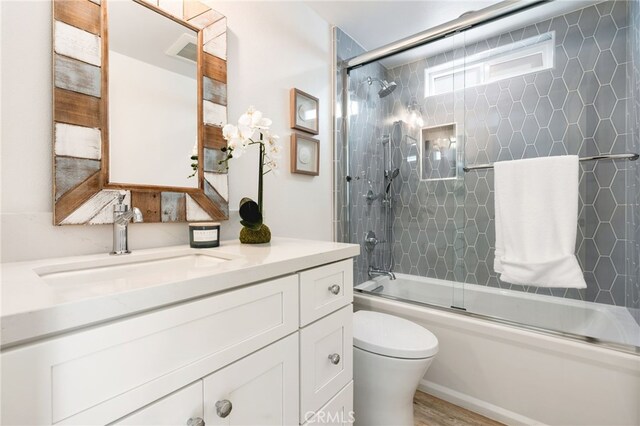 207 E Edgewater Ave Unit A, Newport Beach, CA 92661 - full bath with wood finished floors, vanity, toilet, and bath / shower combo with glass door