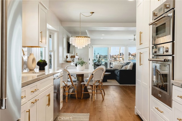 207 E Edgewater Ave Unit A, Newport Beach, CA 92661 - dining area with ceiling fan with notable chandelier, light wood-style flooring, and recessed lighting