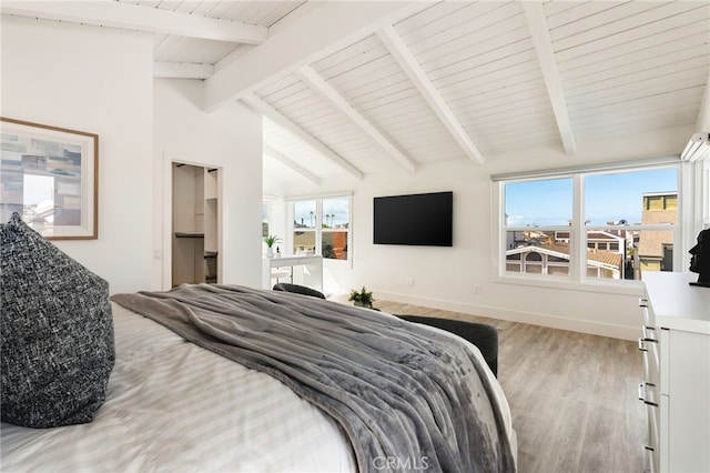 207 E Edgewater Ave Unit A, Newport Beach, CA 92661 - bedroom with light wood finished floors, vaulted ceiling with beams, and baseboards