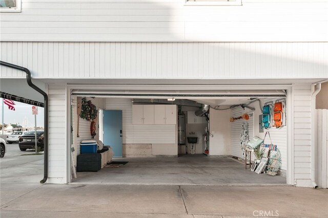 207 E Edgewater Ave Unit A, Newport Beach, CA 92661 - garage featuring water heater