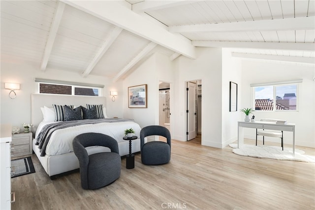 207 E Edgewater Ave Unit A, Newport Beach, CA 92661 - bedroom with lofted ceiling with beams, light wood-style flooring, baseboards, and ensuite bathroom