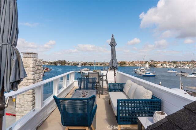 207 E Edgewater Ave Unit A, Newport Beach, CA 92661 - view of patio featuring outdoor lounge area, a water view, and a balcony