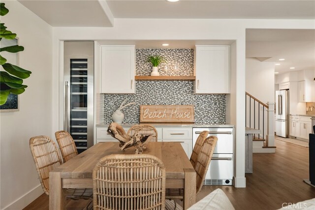 207 E Edgewater Ave Unit A, Newport Beach, CA 92661 - dining area with stairs, dark wood finished floors, baseboards, wine cooler, and recessed lighting