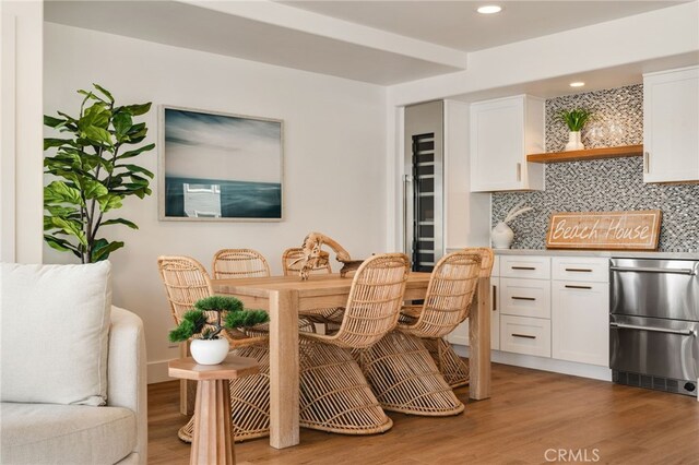 207 E Edgewater Ave Unit A, Newport Beach, CA 92661 - dining room featuring light wood finished floors and recessed lighting