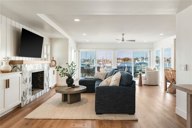 207 E Edgewater Ave Unit A, Newport Beach, CA 92661 - living area with recessed lighting, a high end fireplace, wood finished floors, and ceiling fan