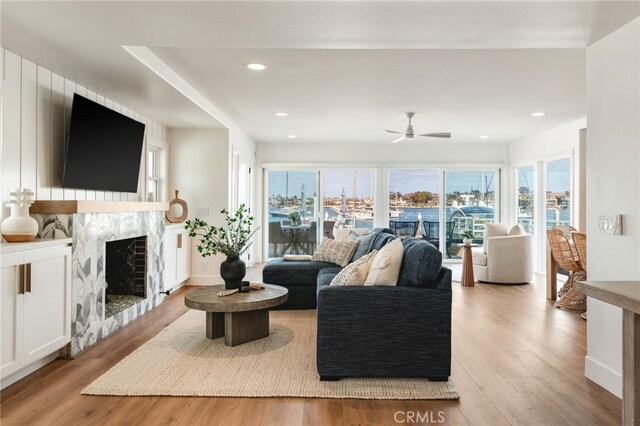 207 E Edgewater Ave Unit A, Newport Beach, CA 92661 - living area featuring ceiling fan, recessed lighting, light wood finished floors, and a fireplace