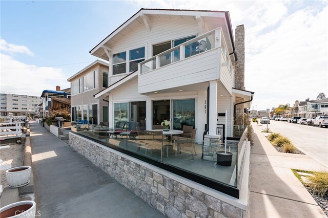207 E Edgewater Ave Unit A, Newport Beach, CA 92661 - back of property with a chimney and a balcony