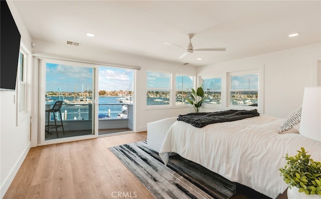207 E Edgewater Ave Unit A, Newport Beach, CA 92661 - bedroom featuring multiple windows, access to exterior, visible vents, and light wood-style floors