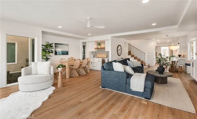 207 E Edgewater Ave Unit A, Newport Beach, CA 92661 - living room with recessed lighting, light wood-style floors, stairs, and ceiling fan with notable chandelier
