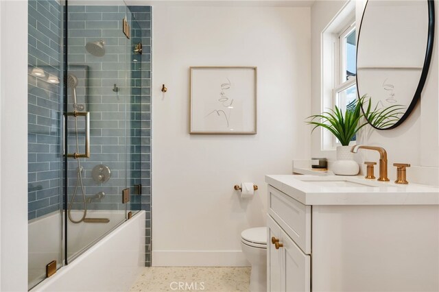 207 E Edgewater Ave Unit A, Newport Beach, CA 92661 - bathroom featuring enclosed tub / shower combo, speckled floor, toilet, vanity, and baseboards