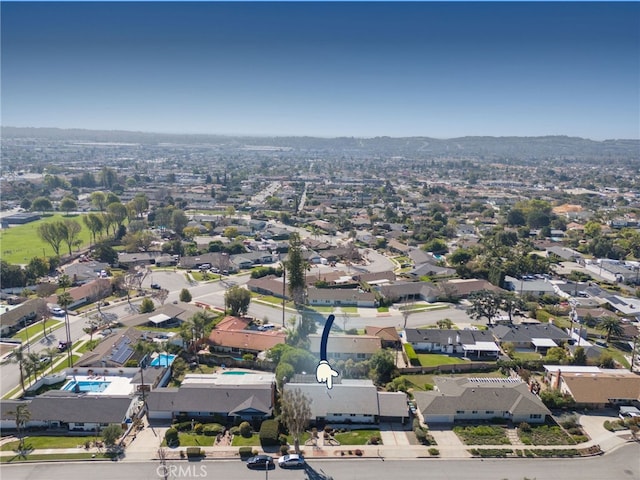 birds eye view of property with a residential view