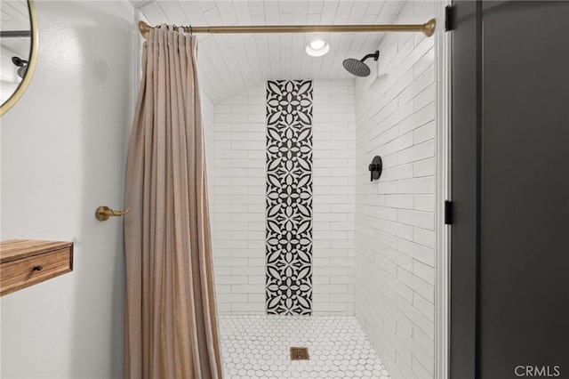 bathroom with a shower stall