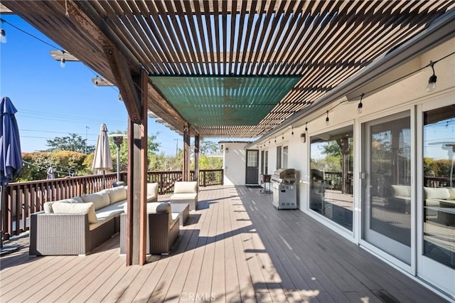 deck with a grill, an outdoor living space, and a pergola