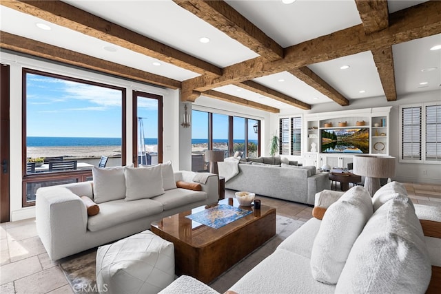 living area featuring stone tile floors, baseboards, built in features, beamed ceiling, and recessed lighting