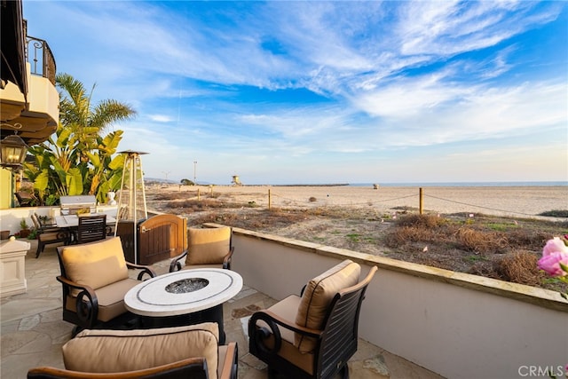 view of patio / terrace with an outdoor fire pit