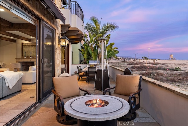 view of patio featuring an outdoor fire pit