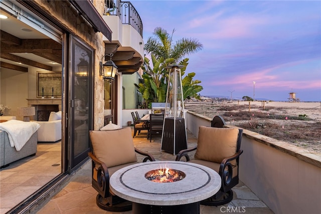 exterior space featuring a fire pit and a patio