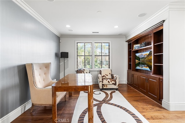 sitting room with crown molding, baseboards, wood finished floors, and recessed lighting