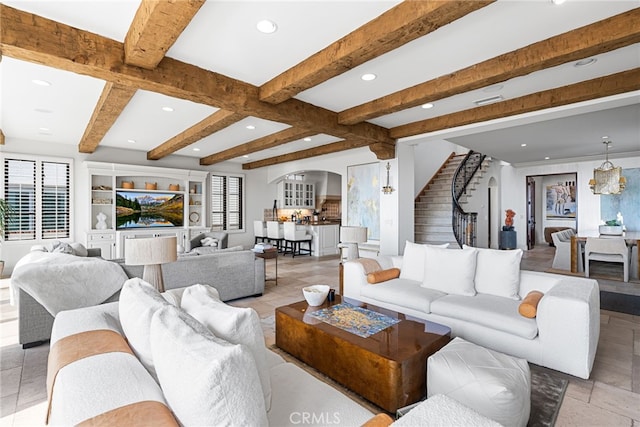 living room with arched walkways, beam ceiling, recessed lighting, and stairway