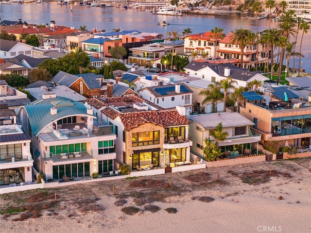 aerial view with a water view and a residential view