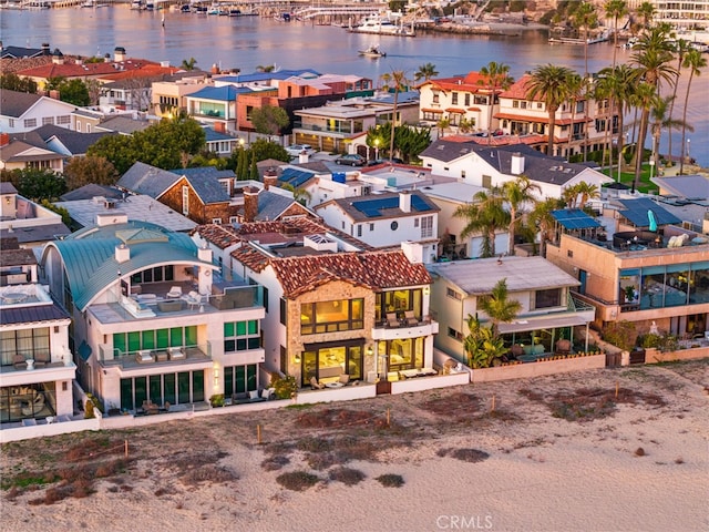 aerial view with a residential view and a water view