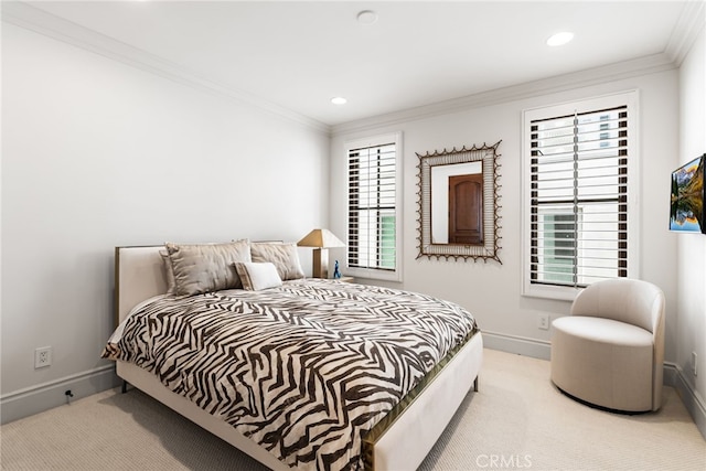 carpeted bedroom with recessed lighting, crown molding, and baseboards