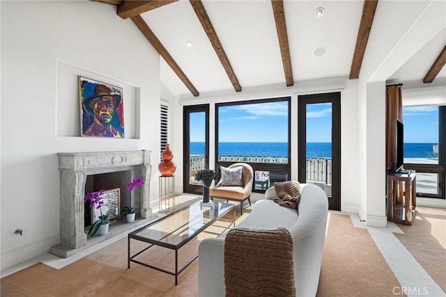 living area with plenty of natural light, light carpet, baseboards, and a fireplace