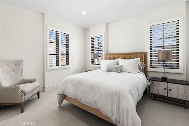 carpeted bedroom with baseboards and recessed lighting