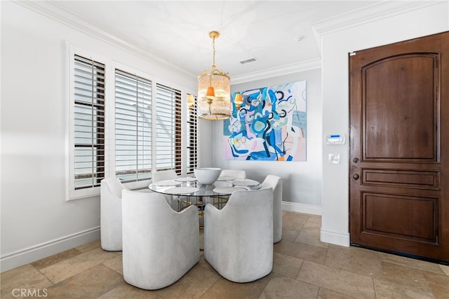 dining room with baseboards, visible vents, ornamental molding, and stone finish flooring