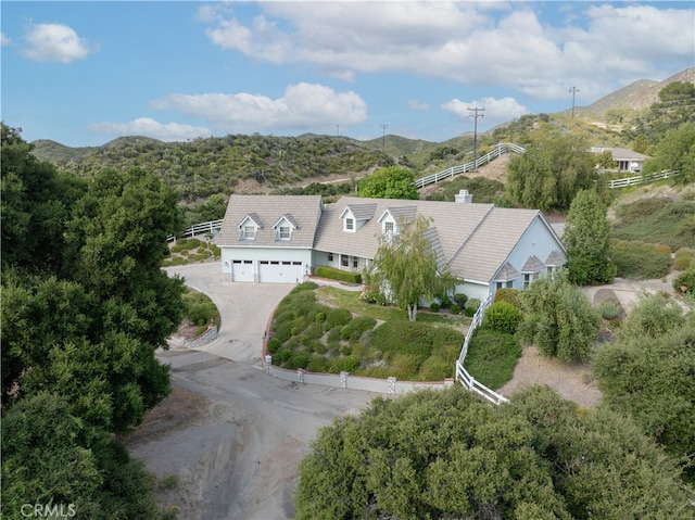 birds eye view of property with a mountain view