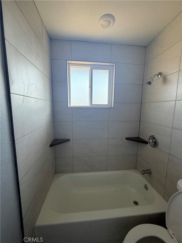 bathroom with toilet and shower / bathtub combination