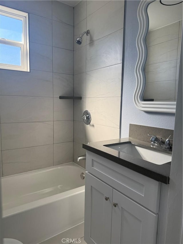 bathroom with vanity and shower / bathing tub combination