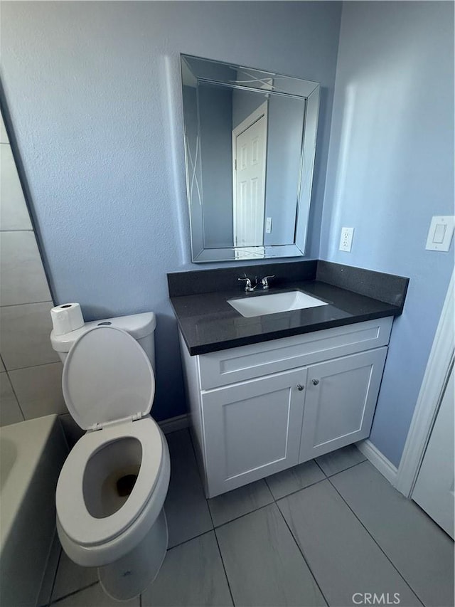 bathroom featuring toilet and vanity