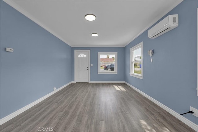 34945 Ave B, Yucaipa, CA 92399 - entryway featuring wood finished floors, ornamental molding, baseboards, and a wall mounted AC