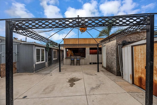 view of patio / terrace featuring outdoor dry bar