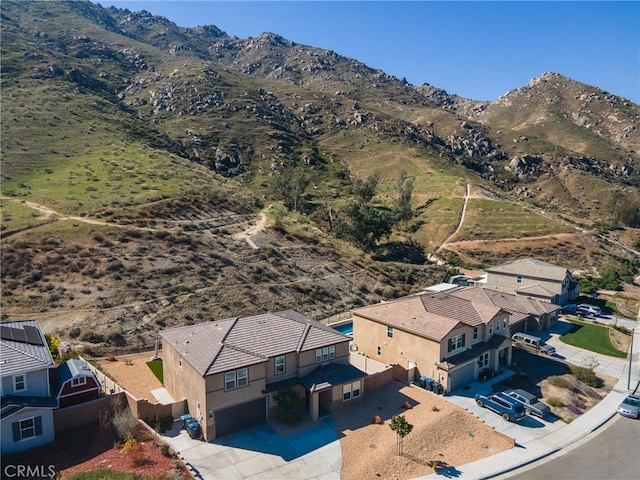 birds eye view of property featuring a mountain view