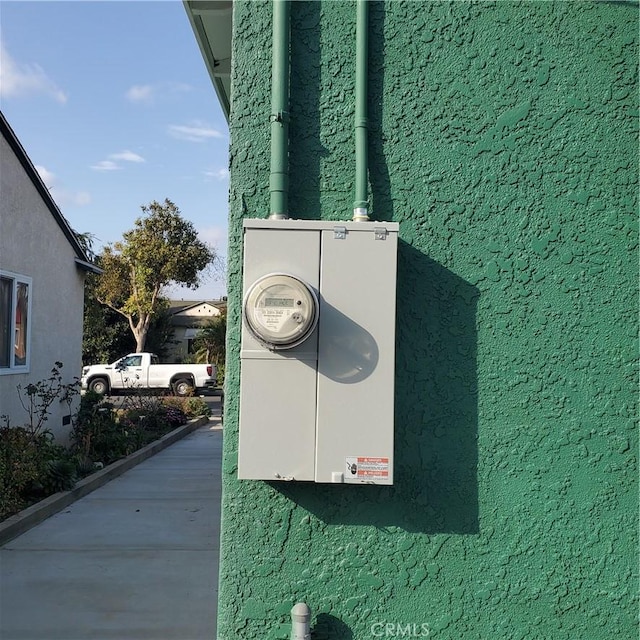 exterior details with electric meter and stucco siding